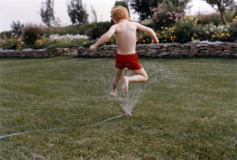 Rob jumps the sprinkler
