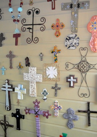 wall of crosses as you enter