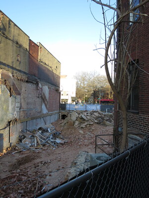 April 1. The back stairs of the Newport West used to exit to a dark corner among walls. Now there is wide open space, and you can see over to the intersection of 14th Street and Rhode Island Ave.