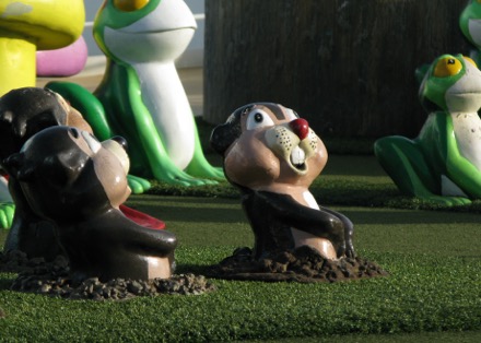 Minigolf characters watching the eclipse without their glasses