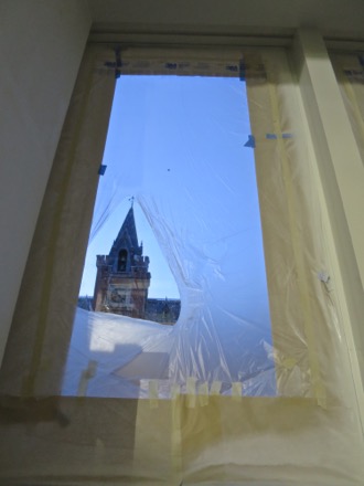 Sumner School to the north, through a tear in the window cover.