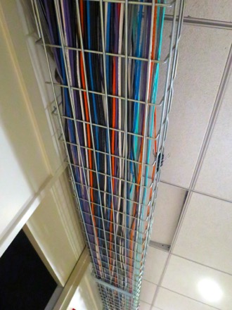A tray of network cables along the ceiling.