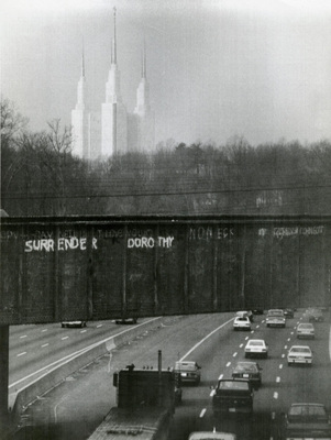 The temple is easily seen from the Beltway, and 'Surrender Dorothy' graffiti has appeared for years, in reference to the Wizard of Oz. (1986)