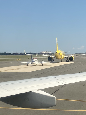 Looks like the yellow plane just gave birth to a little white plane.